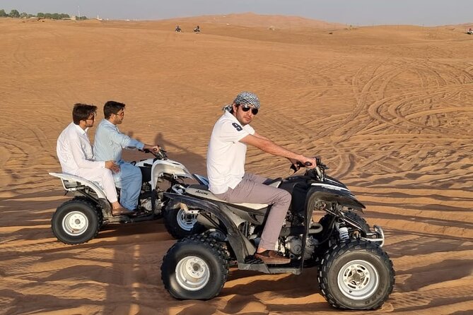 4 Hours Desert Tour with Quad Bike Camel Ride & Sandboard - Thirty minutes of dune bashing and sandboarding