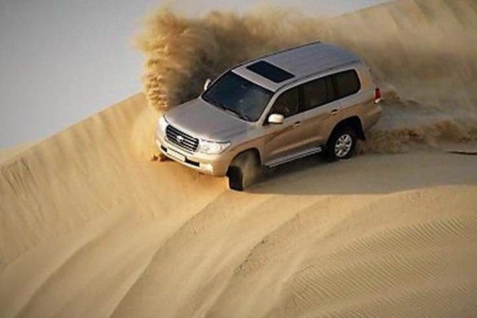 4x4 Deluxe Desert Safari Dubai with Camel Riding - Sunset over the dunes