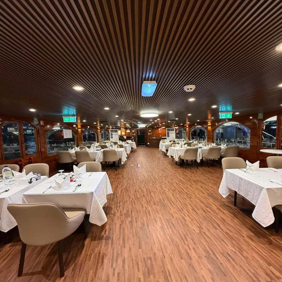5-Star Marina Dhow Dinner Cruise With Live Entertainment - Dubai Marina from the water after dark