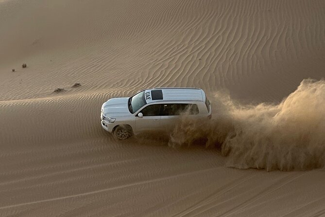 Abu Dhabi: 4-Hour Morning Safari with Camel Ride & Sand boarding - Pickup in a 4x4 Land Cruiser