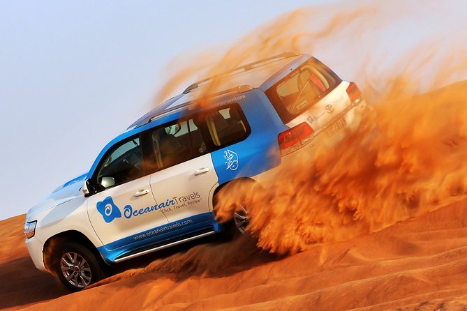Abu Dhabi: Desert Safari with BBQ, Camel Ride & Sandboarding - A camel farm stop before the big ride