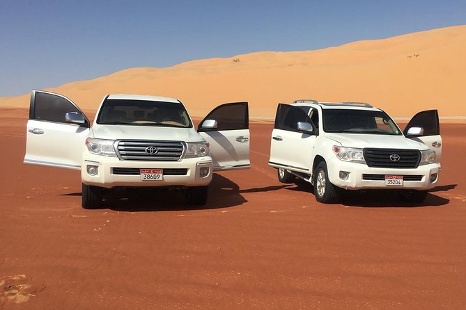 Abu Dhabi Desert Safari with BBQ Dinner & Shows - Sandboarding and the optional quad bike