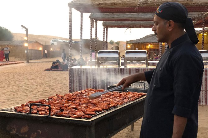Abu Dhabi Evening Desert Safari with BBQ Dinner and all Camp Activities - A torchlit camp and a buffet dinner