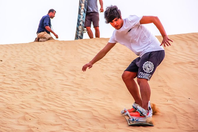 Abu Dhabi Evening Desert Safari with BBQ Dinner and all Camp Activities - Belly dancing and Tanura after dark