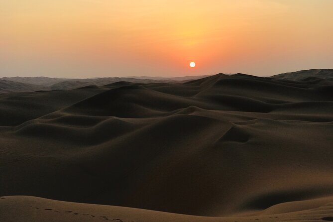 Abu Dhabi Private Desert Camping With BBQ Dinner - The private camp after dark