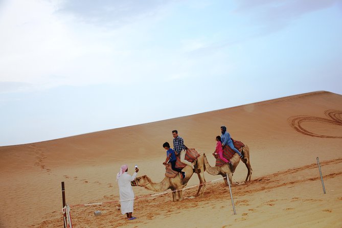 Al Ain Desert Safari with Buffet Dinner - Camel riding and sandboarding at sunset