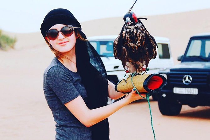 Arabian Desert Safari with BBQ Dinner Camel Ride, Sand Boarding - The Big Red Dunes provide the evening’s real thrill