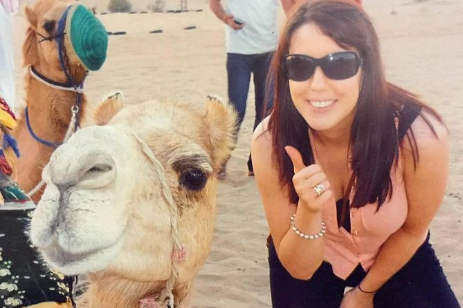 Arabian Desert Safari with BBQ Dinner Camel Ride, Sand Boarding - Tanoura, fire, and belly dancing after dark