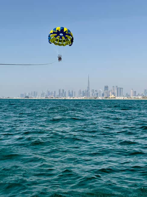 Combo: 30-Min Jet Ski to Burj Al Arab & Solo Parasailing - Jet skiing toward Dubai’s sail-shaped icon