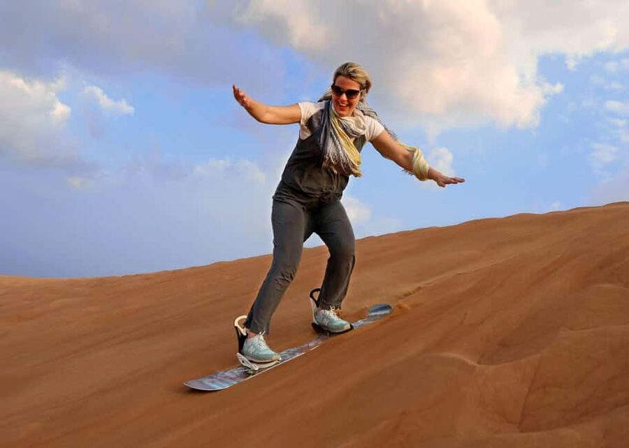 Desert Safari Dubai with Camel Ride, Sandboarding & Dinner - Sandboarding without a ski lift