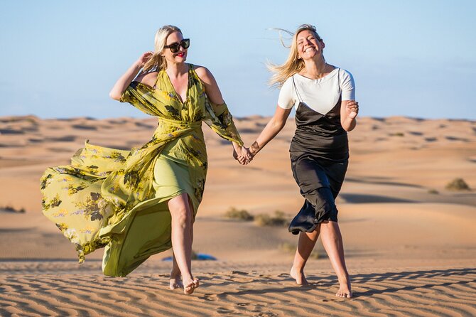 Desert Safari Dubai with Dune Bashing, Activities and Dinner - Henna, Arabic clothing, and desert photographs
