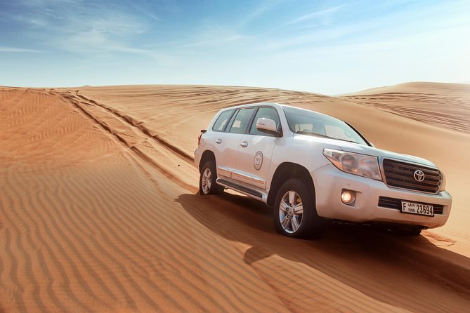 Desert Safari Dubai with Dune Bashing, Sandboarding, Camel Ride, 5 Shows, Dinner - Henna, Arabic dress, and the Bedouin-style camp