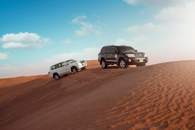 Desert Safari Dubai with Dune Bashing, Sandboarding, Camel Ride, 5 Shows, Dinner - The 4x4 ride across the golden sand
