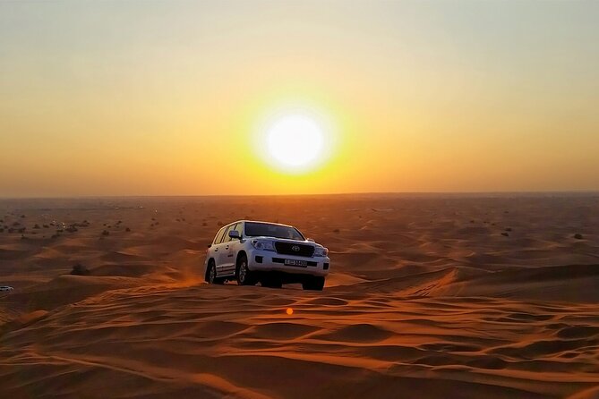 Desert Safari in 4x4 Car with BBQ Dinner and Belly Dance - Sunset photos, henna, and traditional dress