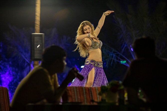 Desert Safari in 4x4 Car with BBQ Dinner and Belly Dance - Camel riding and sandboarding at camp