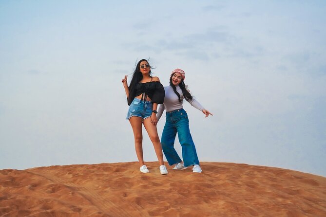 Desert Safari, Open Desert Quad Bike Experience with BBQ Dinner - Sandboarding and camel riding keep the camp stop varied