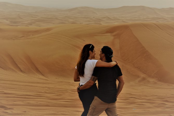 Desert Safari Tour, Quad Bike with BBQ Dinner & Show from Dubai - Sandboarding and sunset photographs