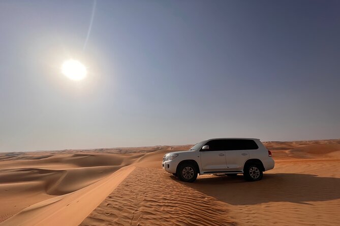 Desert Safari with Dune Bashing and Camel Ride plus Sand Boarding - The camel farm and first look at the dunes