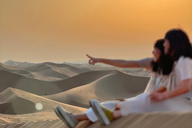 Desert Safari with Dune Bashing and Camel Ride plus Sand Boarding - Sunset photographs in the open desert