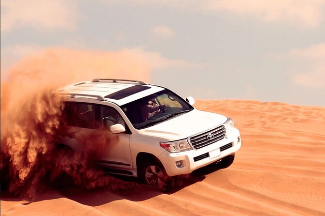 Desert Safari with Quad Bike, 4x4 Dune Bashing and Camel Ride - Dune bashing and sandboarding at Lahbab