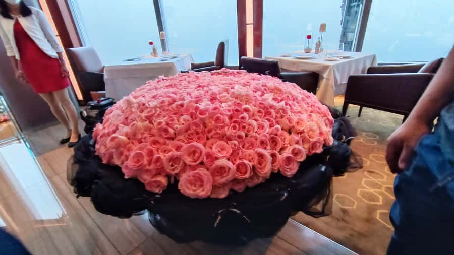 Dubai: Burj Khalifa Sunset Engagement with Porsche Pickup - Champagne, cocktails, perfume, and roses