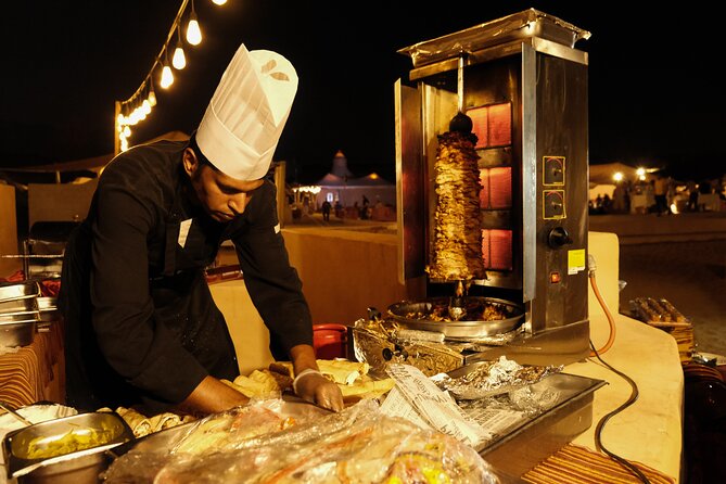 Dubai Desert Camp Dinner with BBQ, Dinner, Camel Ride & Shows - Belly dancing, Tanura, and the fire show