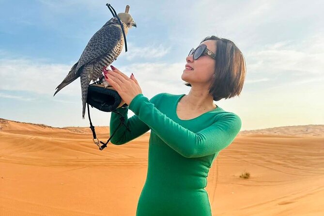 Dubai Desert Escape: Red Dunes Safari, Falcon, Camel & BBQ Dinner - Meeting the falcon and entering the Bedouin-style camp