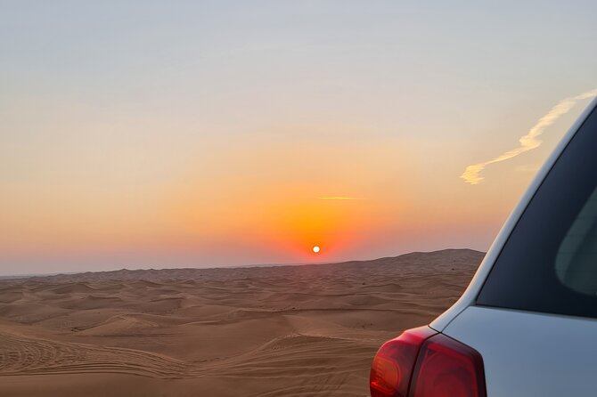 Dubai Desert Safari & Buffet Dinner and Camel ride with PRIVATE CAR - A shared Bedouin-style camp after dark