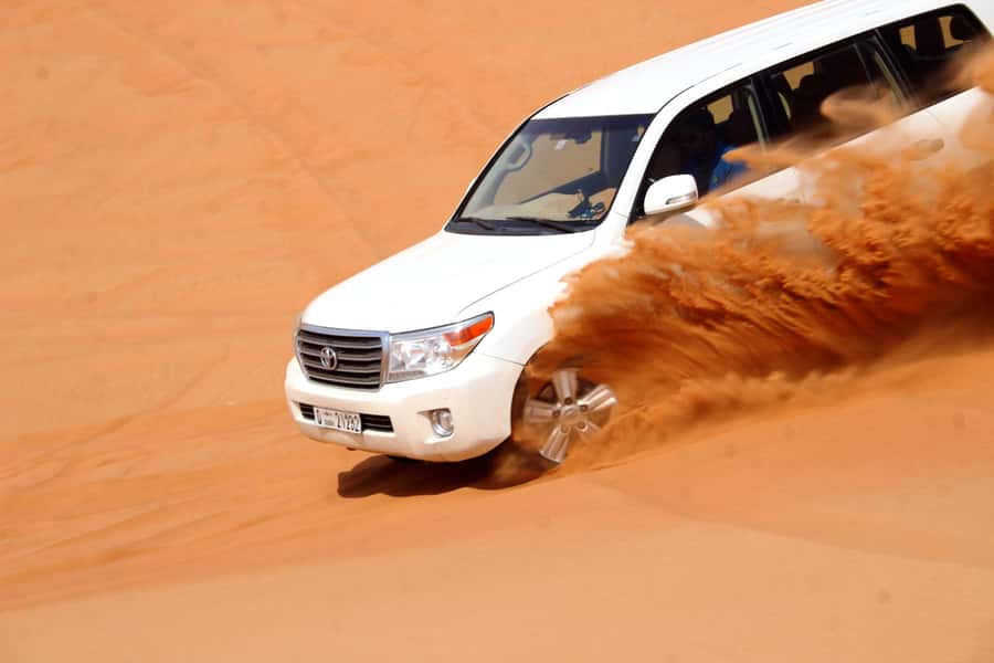 Dubai: Desert Safari, Camel Ride, Sandboarding, Quad Bike - Sandboarding on the Red Dunes