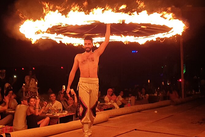 Dubai: Desert Safari, Camel Ride, Show & Optional Dinner - Sunset, campfire, henna, and local dress