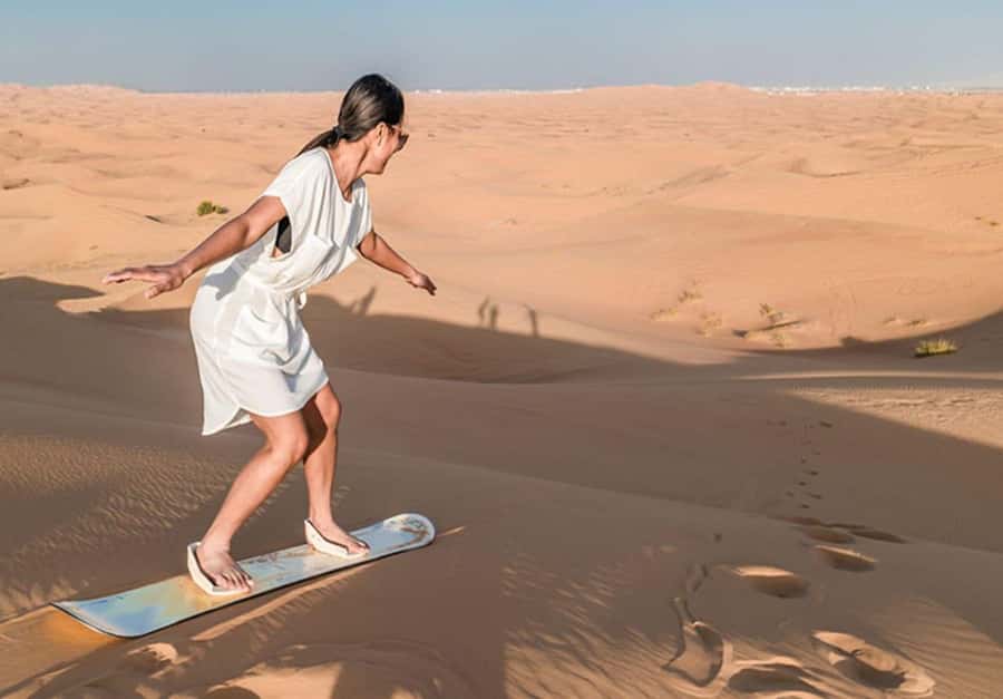 Dubai: Desert Safari Camel Riding, Sandboarding & BBQ Dinner - Dune bashing in a 4WD