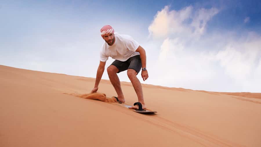 Dubai Desert Safari - Premium BBQ Dinner, Camel Ride & Shows - Sunset at a Bedouin-style desert camp