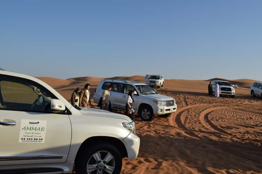 Dubai: Desert Safari, Quad Bike, Camel Ride and Sandboarding - Optional quad biking across the open sand