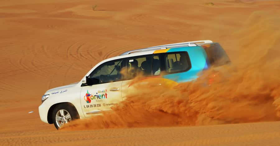 Dubai Desert Safari, Quad Biking, Camel Ride, & Sandboarding - Lahbab photo stop and the first rush of sand