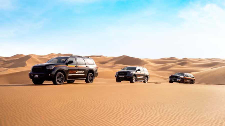 Dubai Desert Safari - Sandboarding, Quad Bike & BBQ Options - Dune bashing across Lahbab