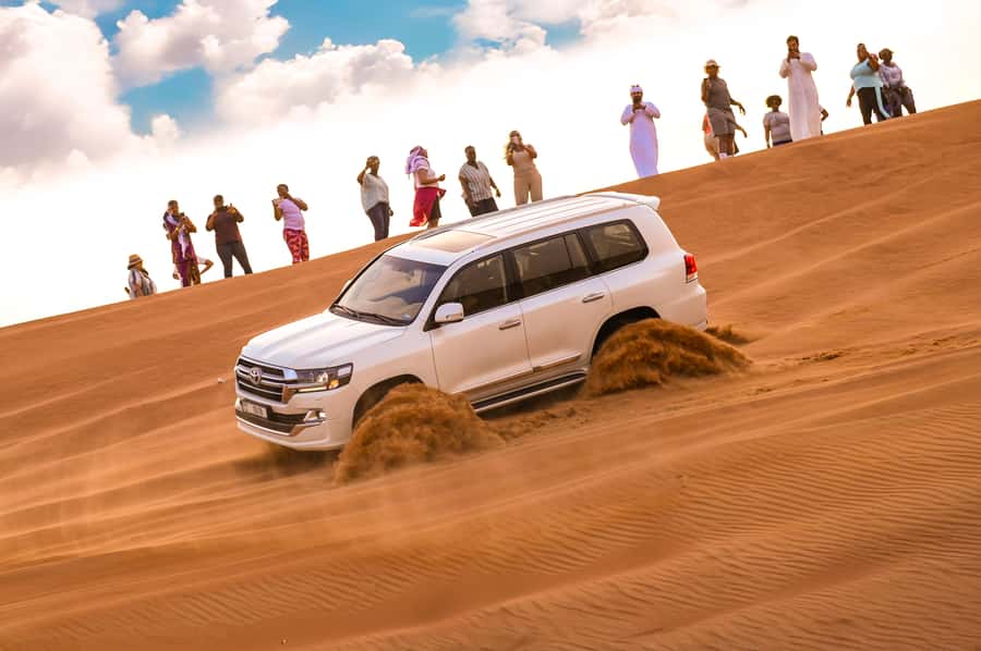 Dubai: Desert Safari with BBQ Dinner & Quad Biking Options - Red sand and a rough 4x4 ride