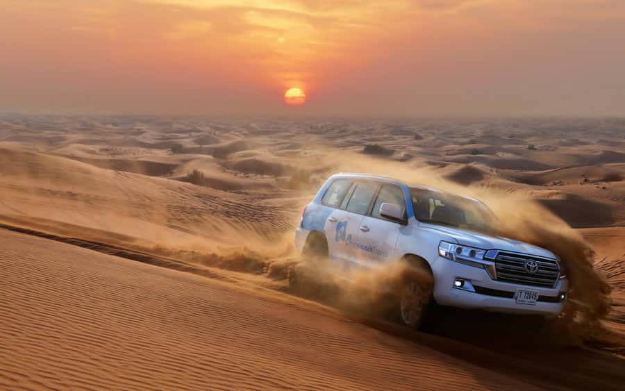 Dubai: Desert Safari with Camp, Dinner, & Optional Overnight - Dune bashing and sandboarding on the red dunes
