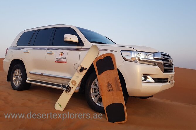 Dubai Desert Safari with Quad Bike, sandboarding, live show & BBQ - Camp traditions, camel rides, and henna