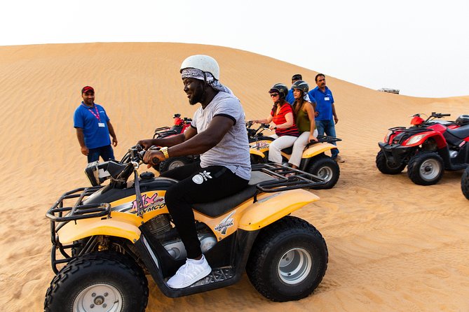 Dubai Desert Safari with Quads, BBQ Dinner, Camel ride, & Shows - A short camel ride and a stop at the camel farm