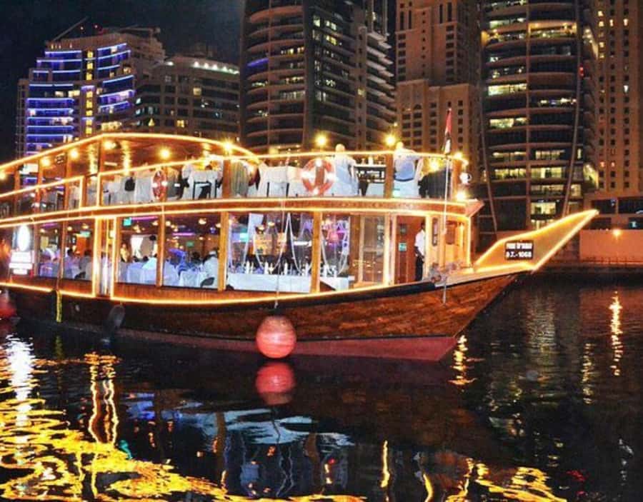 Dubai: Dhow Dinner Cruise on Creek or Marina with Live Shows - Sunset views and Dubai after dark