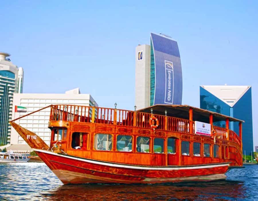 Dubai: Dhow Dinner Cruise on Creek or Marina with Live Shows - Boarding a traditional dhow