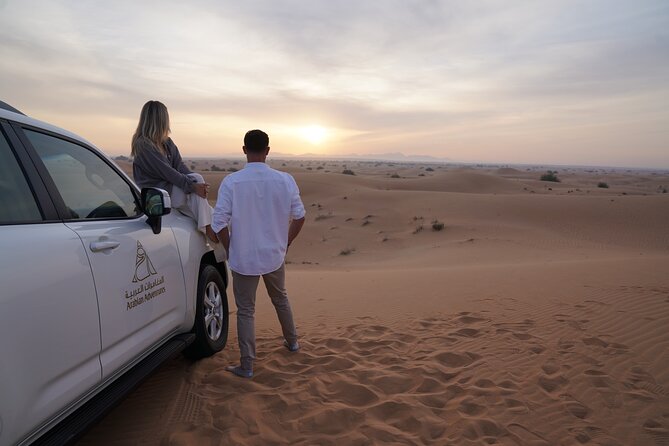 Dubai Evening Desert Safari: Sandboarding, BBQ, Camel Ride & more - Dune bashing in a six-seat 4WD