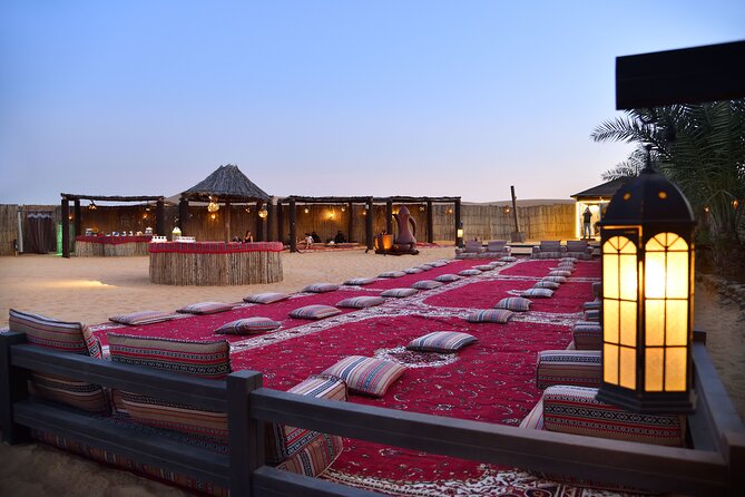 Dubai Evening Desert Safari: Sandboarding, BBQ, Camel Ride & more - Henna, falcons, and camp time