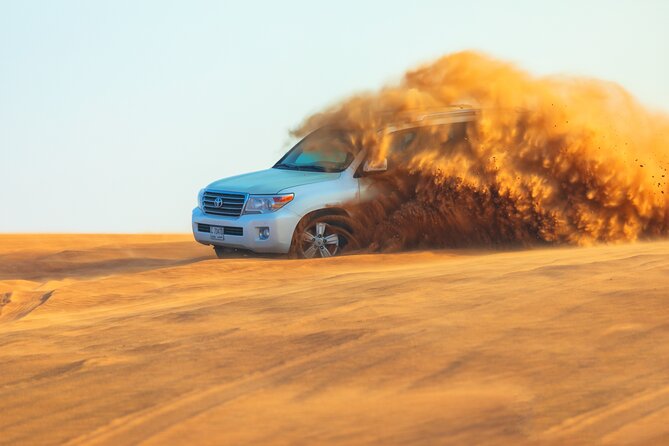 Dubai Evening Desert Safari With Transfers Dune Bashing & Dinner - Optional quad bikes before the main ride