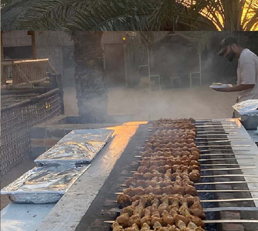 Dubai: Evening Tour with Quad Biking, Camel Ride, and BBQ - Red dunes, fast wheels, and a full evening out