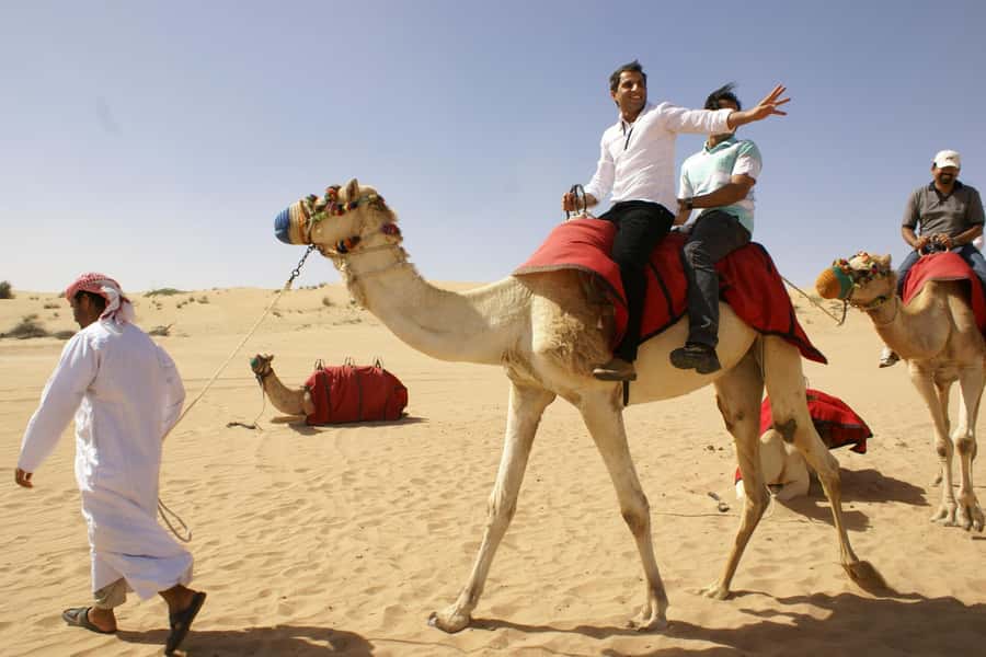 Dubai: Evening Tour with Quad Biking, Camel Ride, and BBQ - The camel ride is a short taste of tradition
