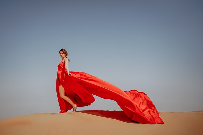 Dubai: Flying Dress with Photography and Exciting Dune Activities - The red dress moment at Lahbab Desert