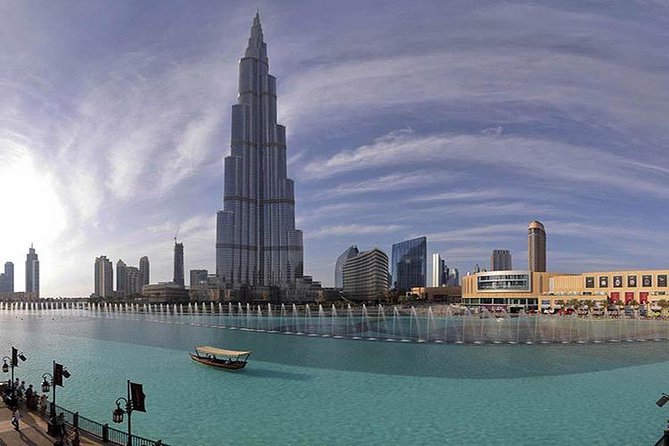 Dubai: Fountain Show and Burj Lake Ride by Traditional Boat - A traditional abra in the middle of Downtown Dubai