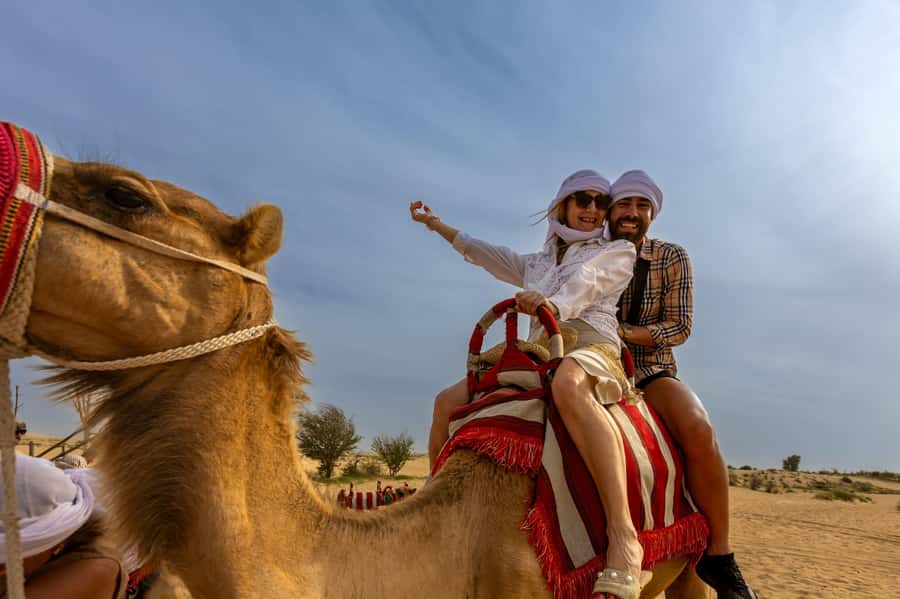 Dubai: Helicopter Ride, Desert Safari, Camels & Refreshments - From Dubai hotels to the red dunes of Lahbab