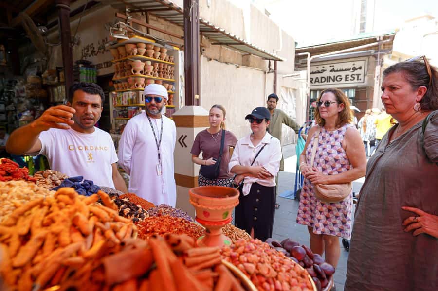 Dubai: Helicopter Ride, Old Town Walking Tour, Abra & Snacks - Moving from the skyline to Al Fahidi